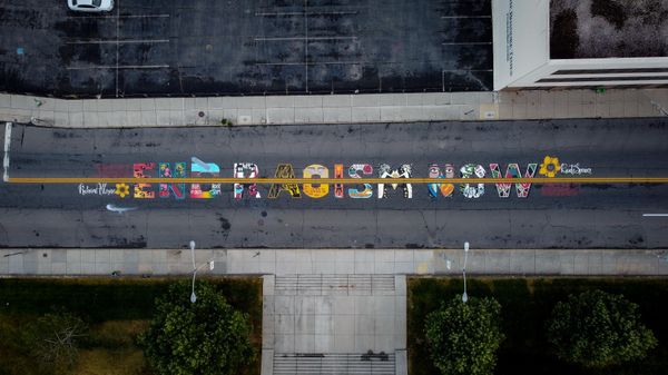 Roanoke Police Officer Sues City Over Facebook Post About 'End Racism Now' Street Mural